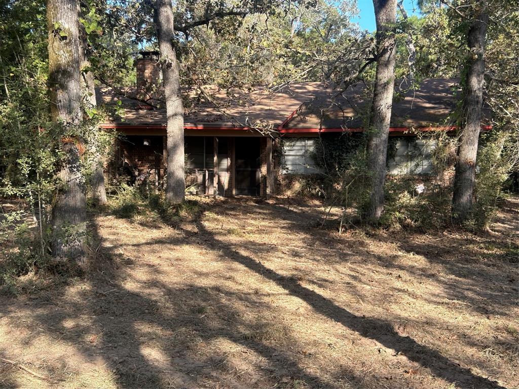 a view of a house with a tree