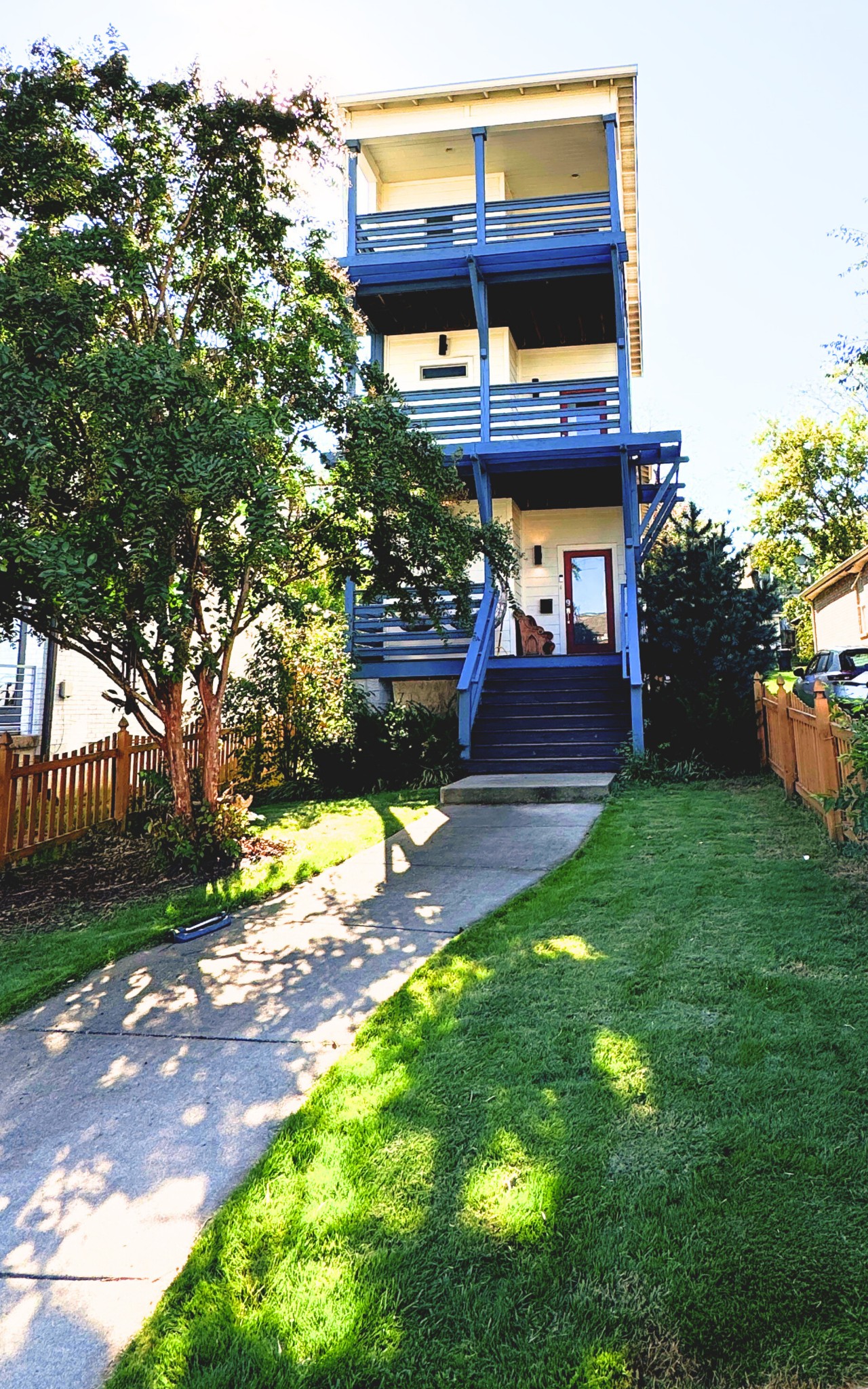 a view of a bench in front of a house