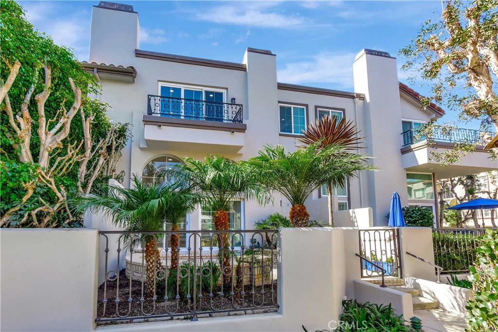 a view of house with palm tree in front