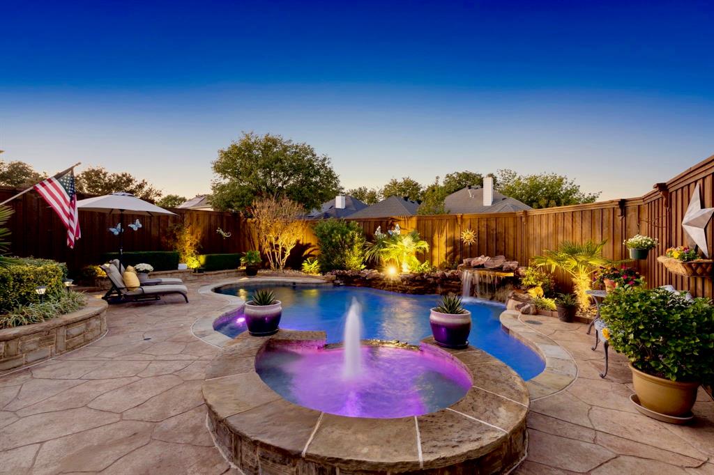 a view of a swimming pool with sitting area