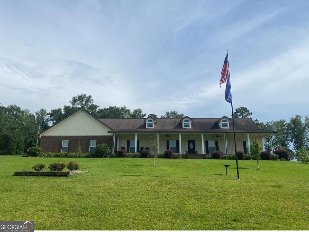 a front view of a house with a yard