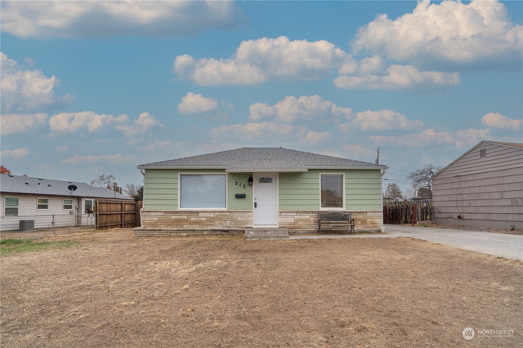 a view of a house with a yard