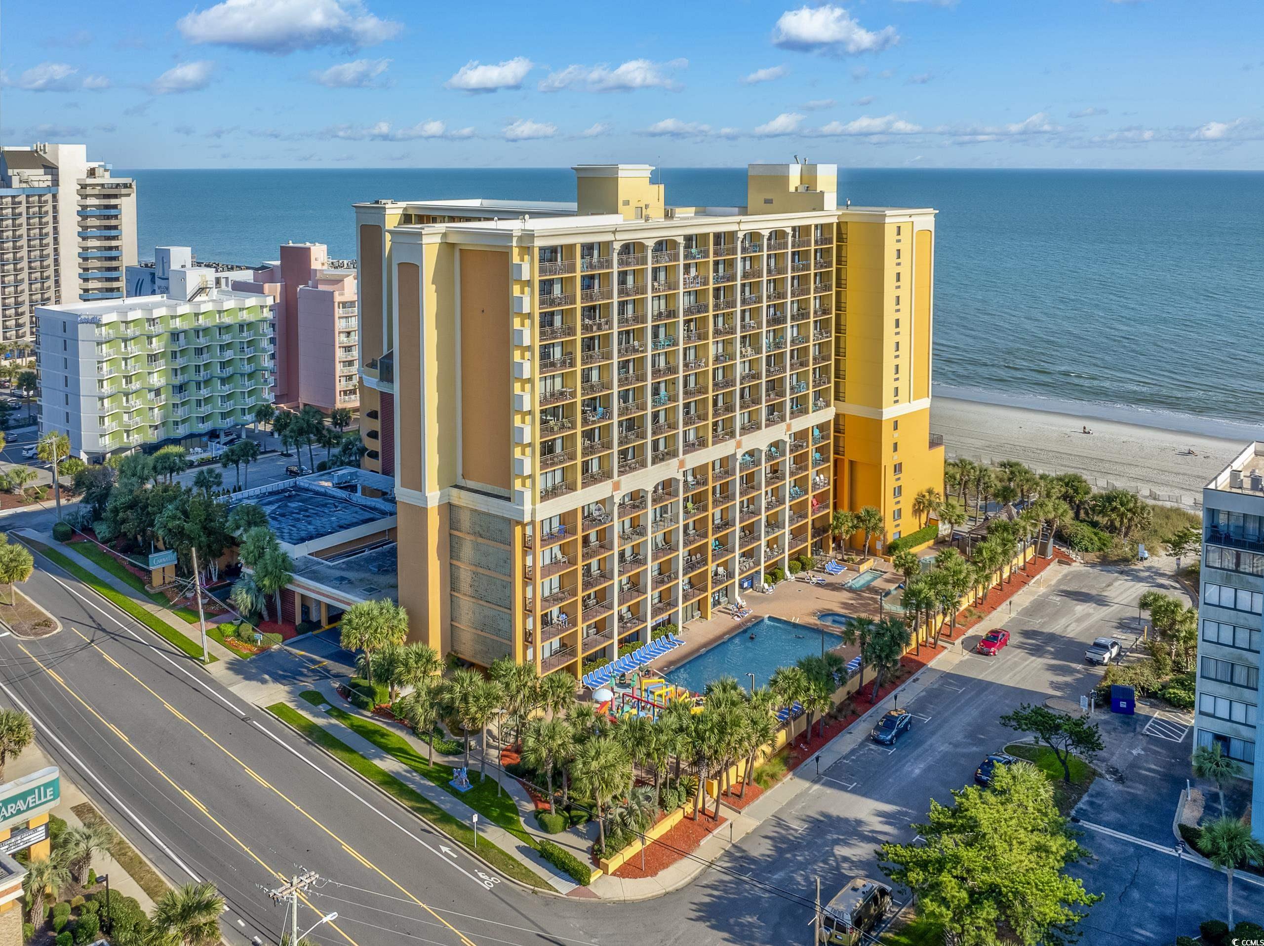 Drone / aerial view with a view of the beach and a