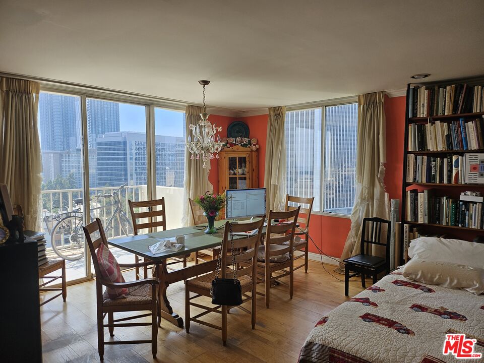 a view of a livingroom with furniture and bookshelf