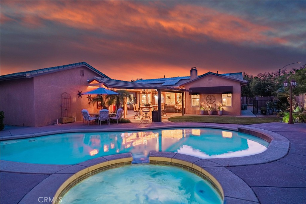 a view of swimming pool with a yard