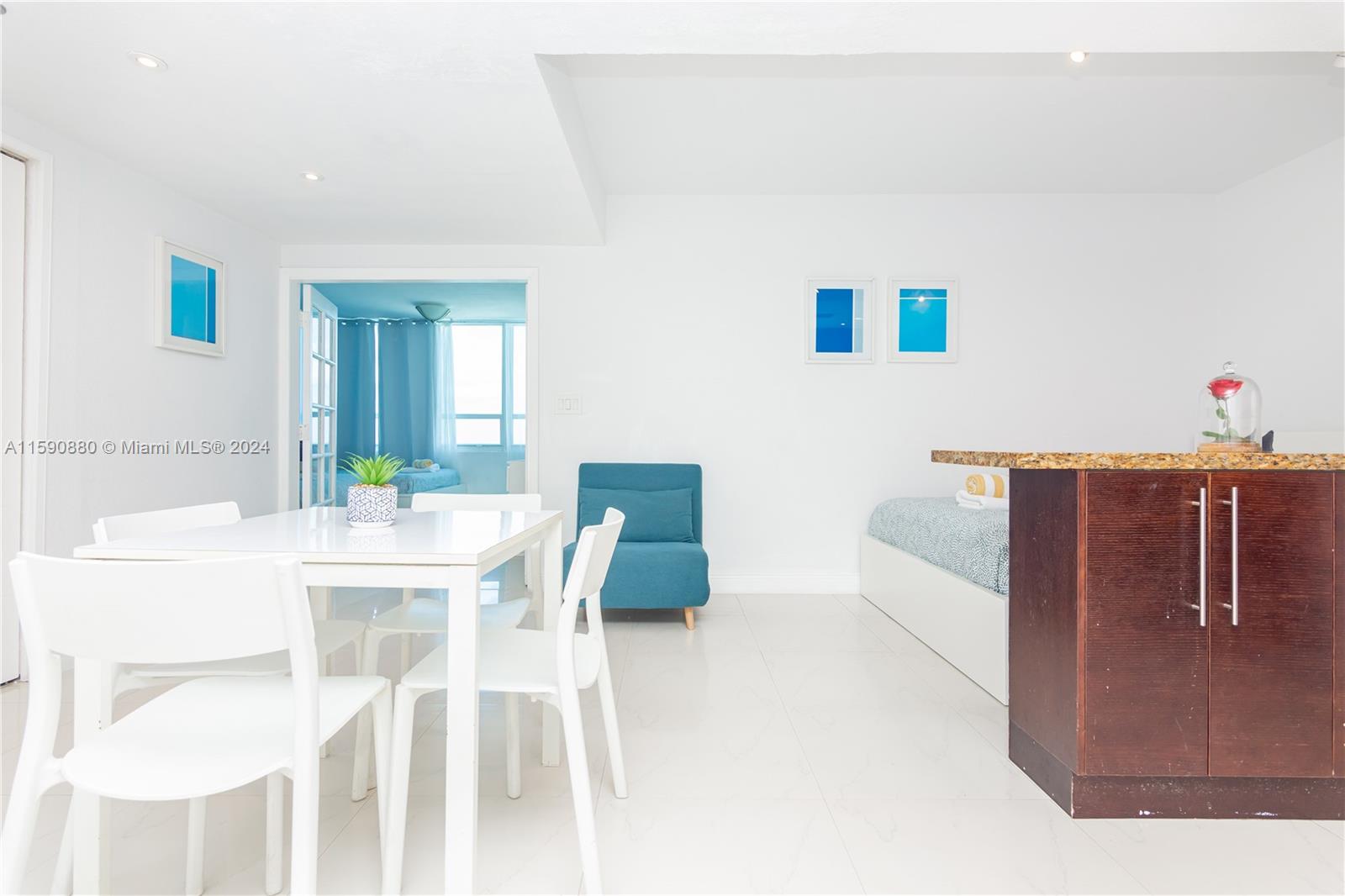 a dining room with a table and chairs