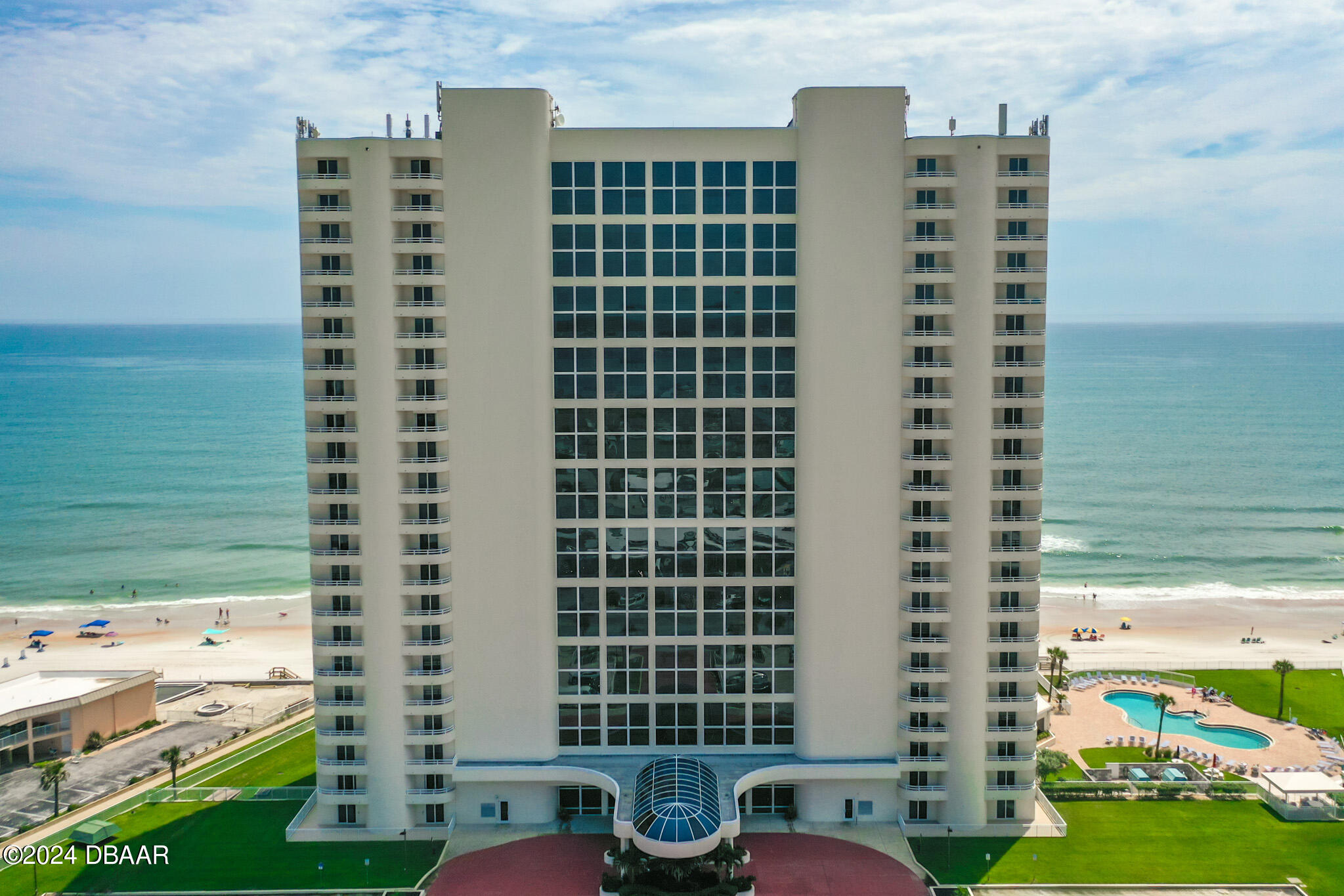 a front view of a building with outdoor space