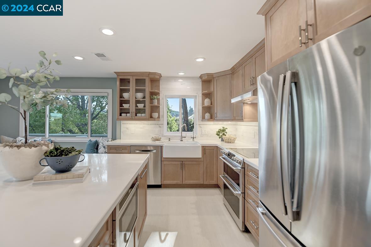 a kitchen with counter top space and appliances