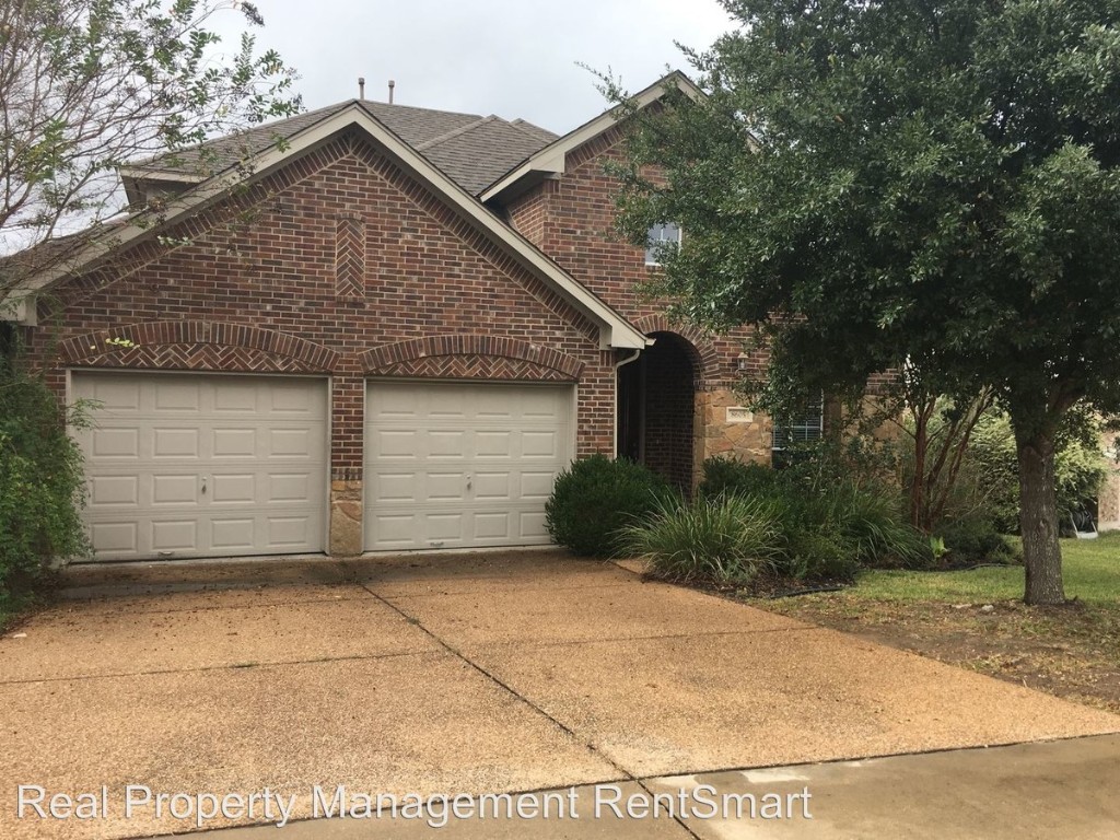 a front view of a house with a garage