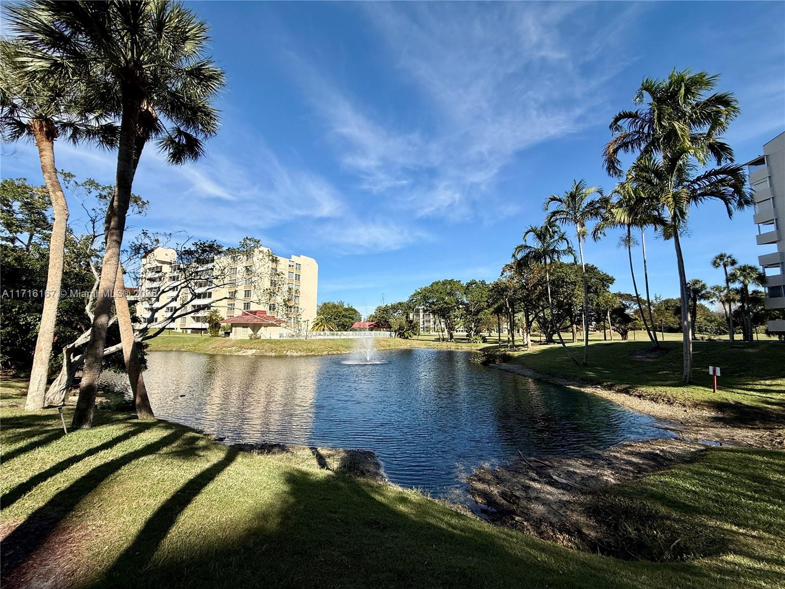 a view of a swimming pool with a lake view