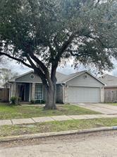 a house that has a tree in front of it