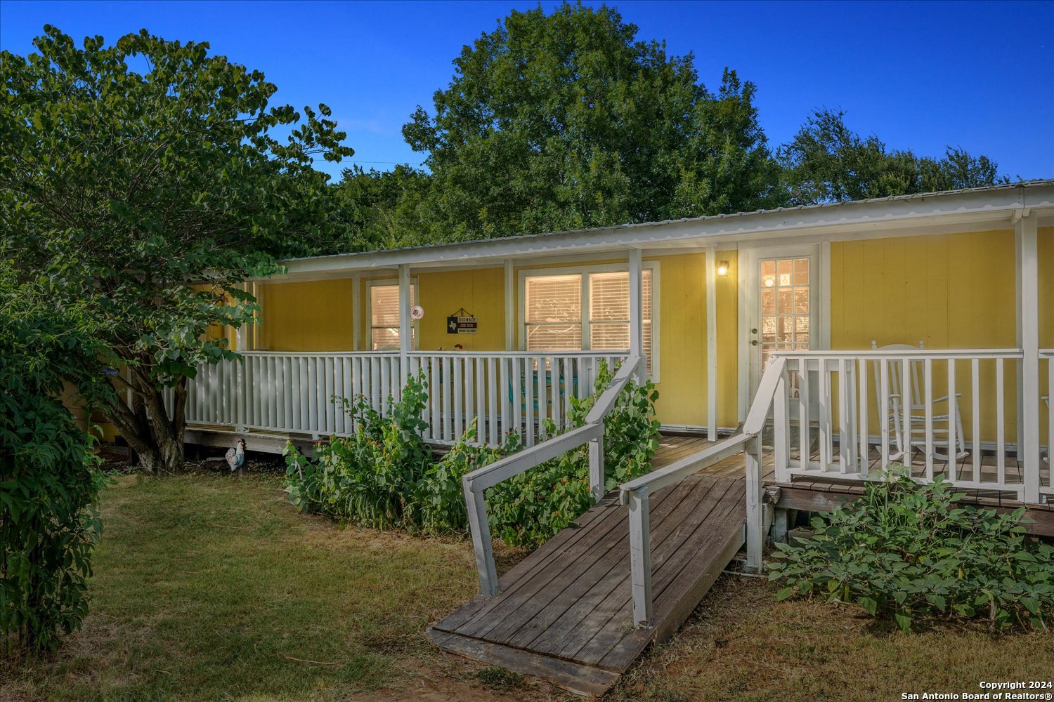 a view of a small deck with a small yard