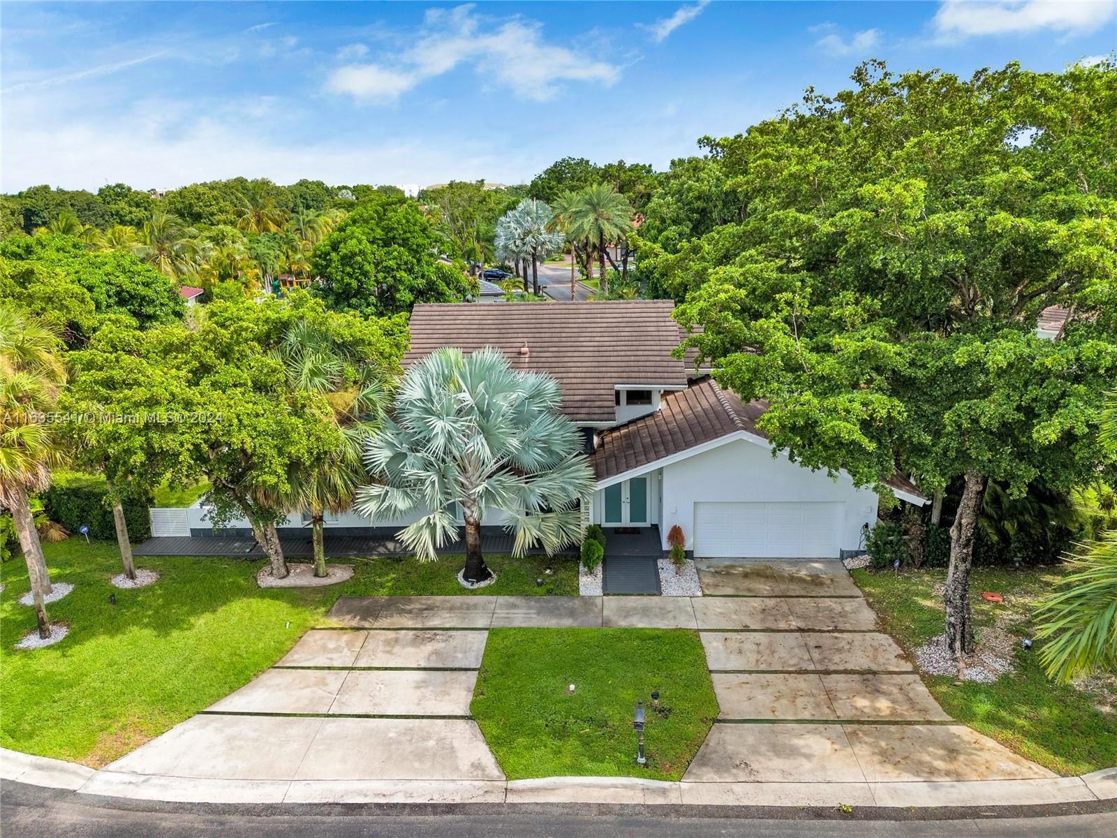 a aerial view of a house with a yard