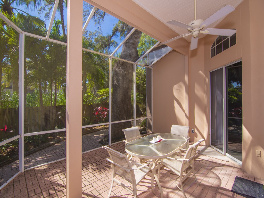 a view of a balcony dining table and chairs