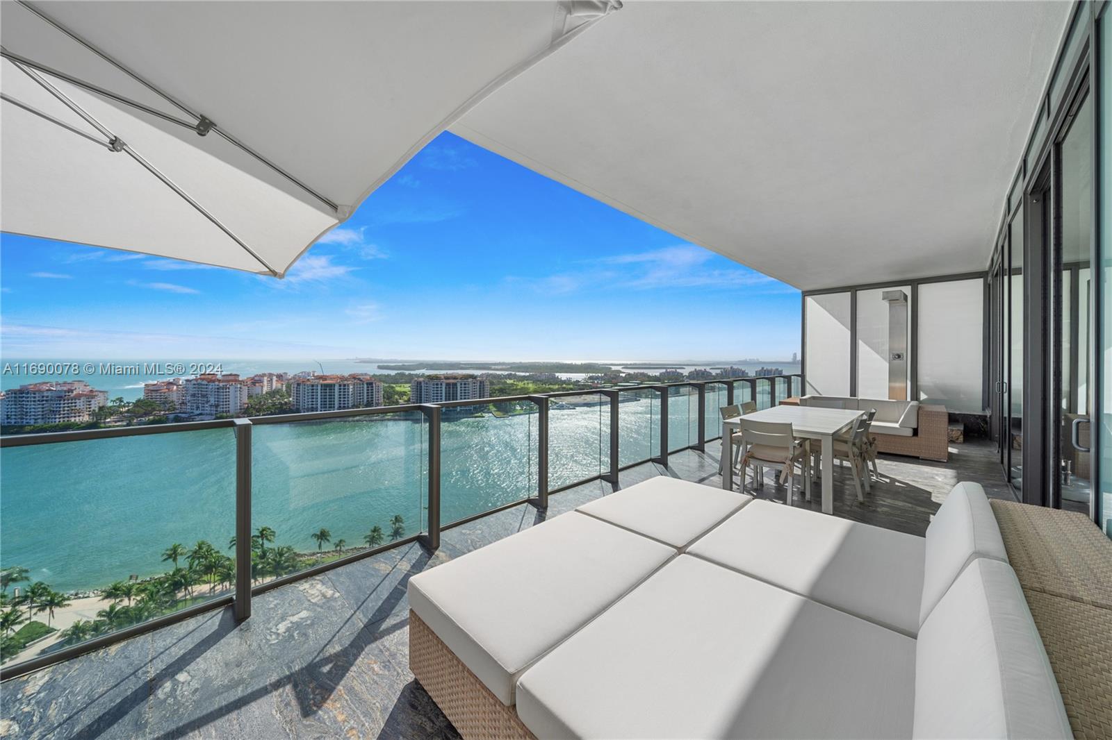 a terrace with outdoor seating and water view