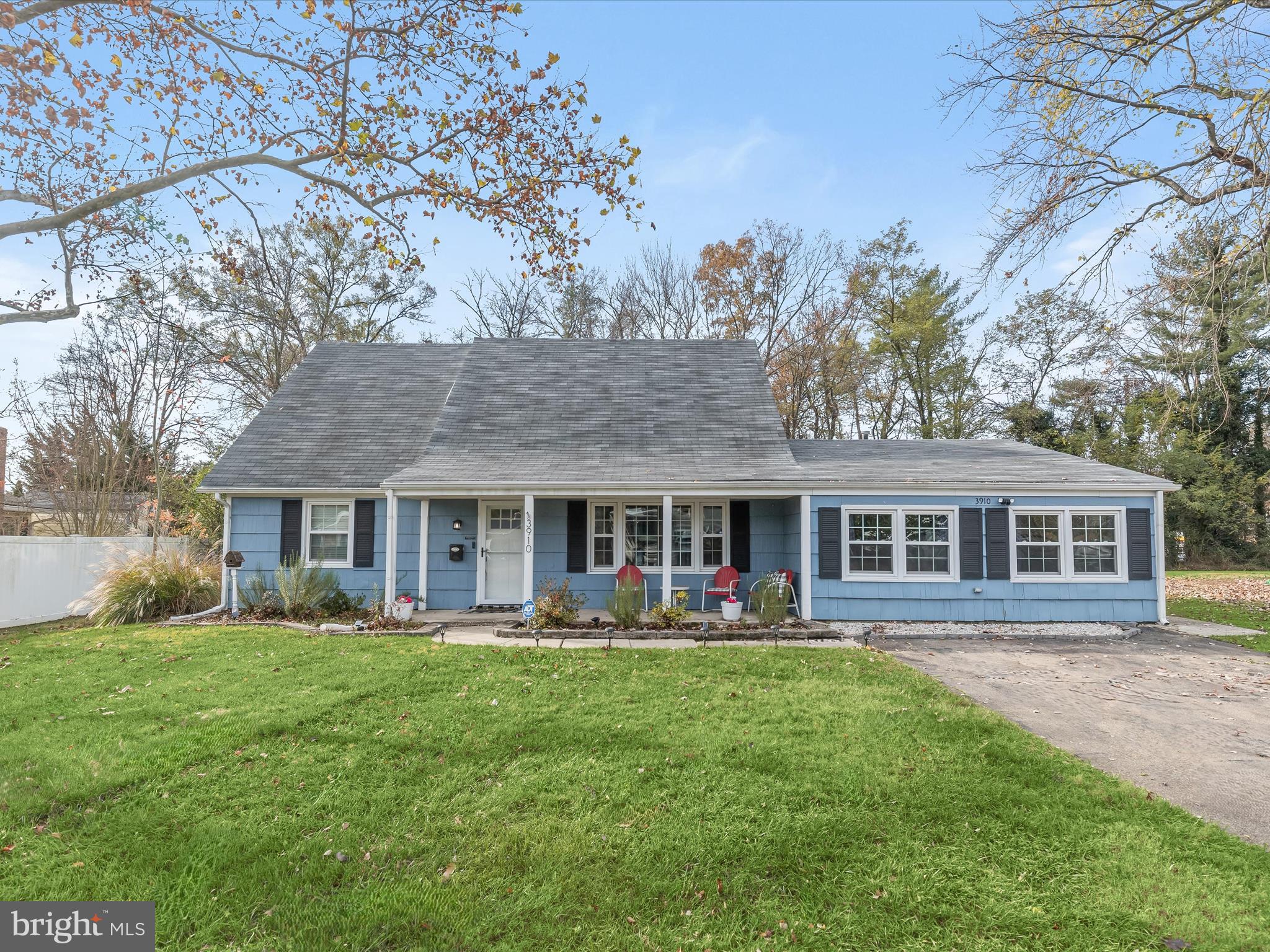 a front view of house with yard and green space