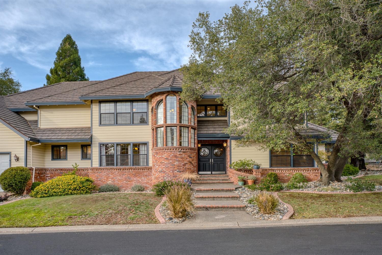 a front view of a house with a yard