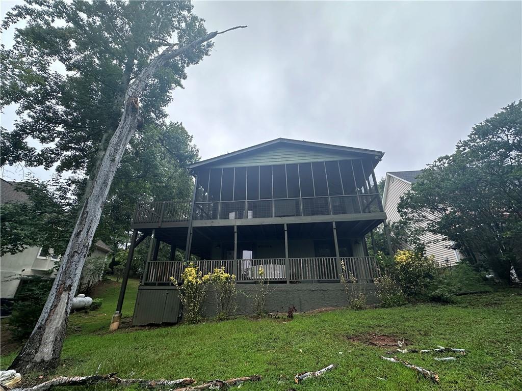 a front view of house with a garden