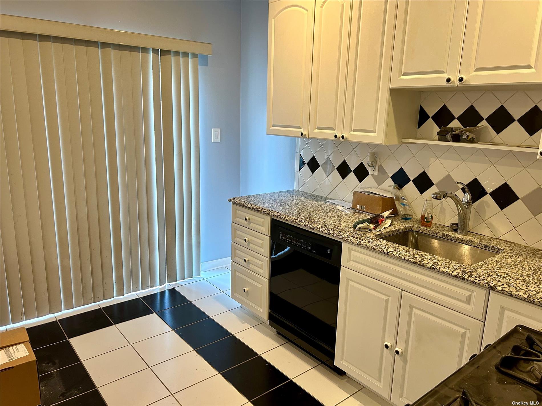 a kitchen with a stove and cabinets