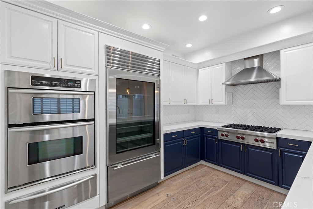 a kitchen with stainless steel appliances granite countertop a stove and a microwave