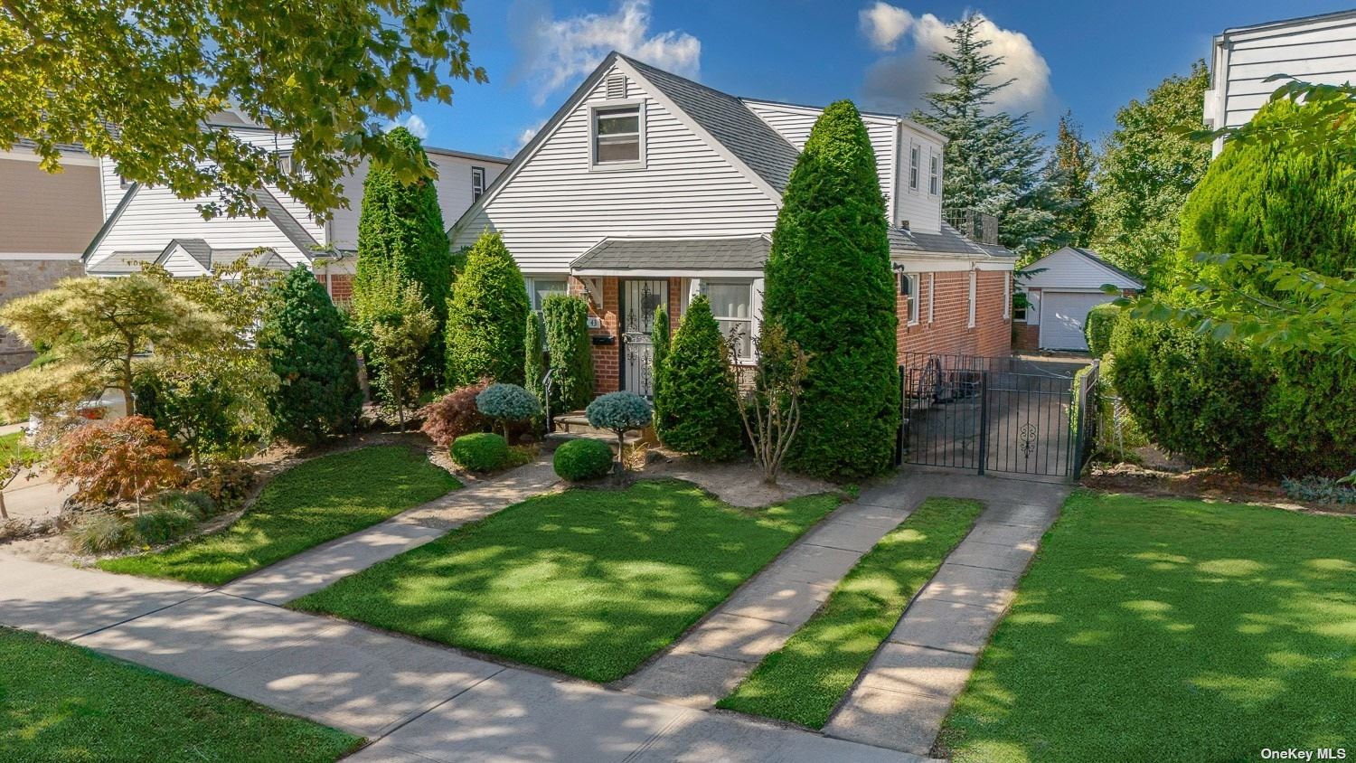 a view of a house with a yard and plants