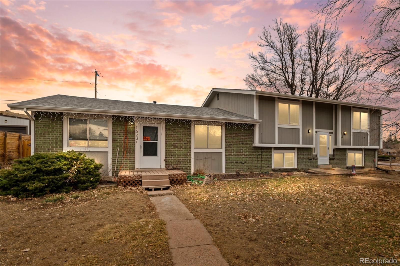 a front view of a house with yard in front of it