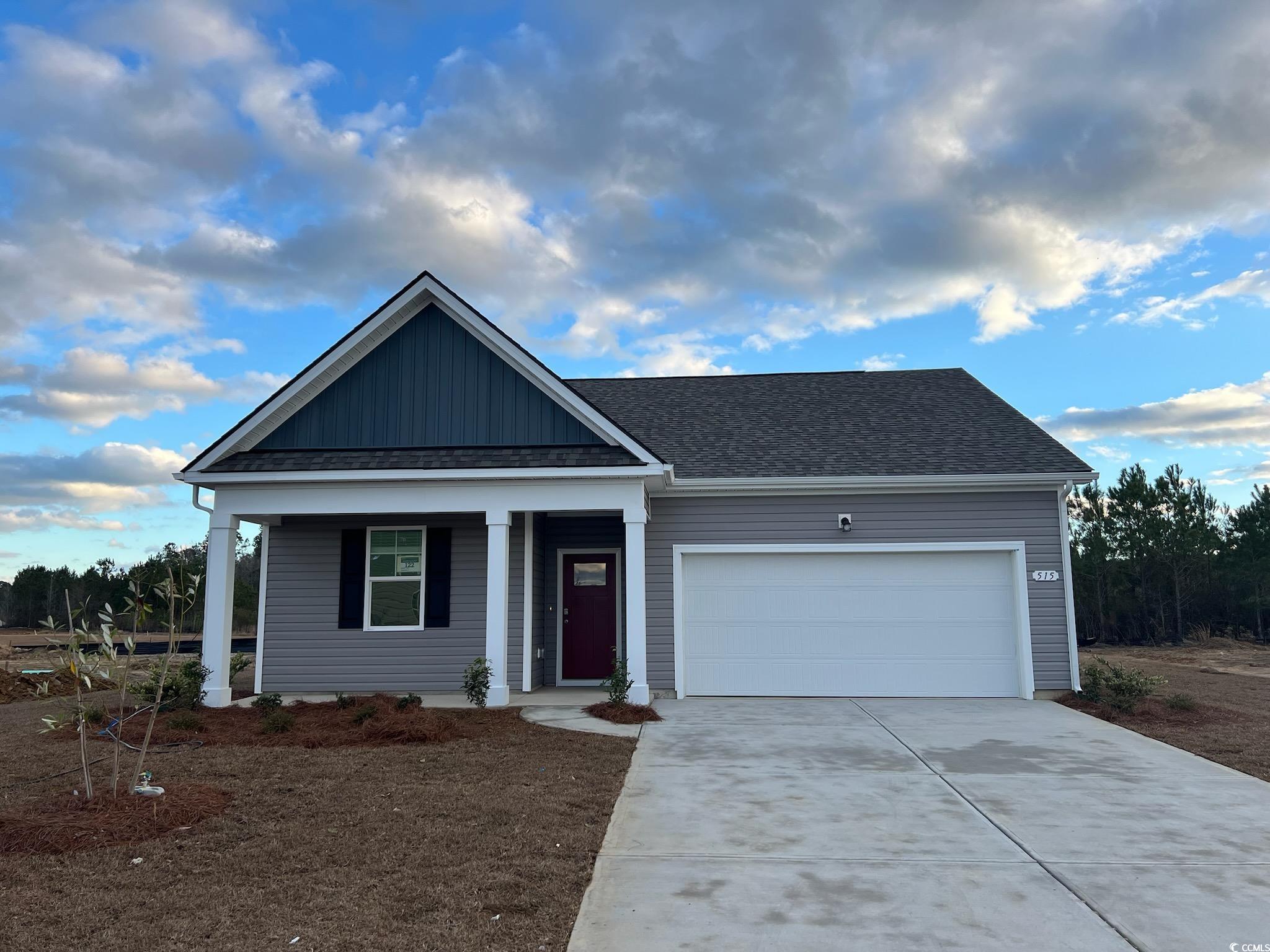 View of front facade featuring a garage