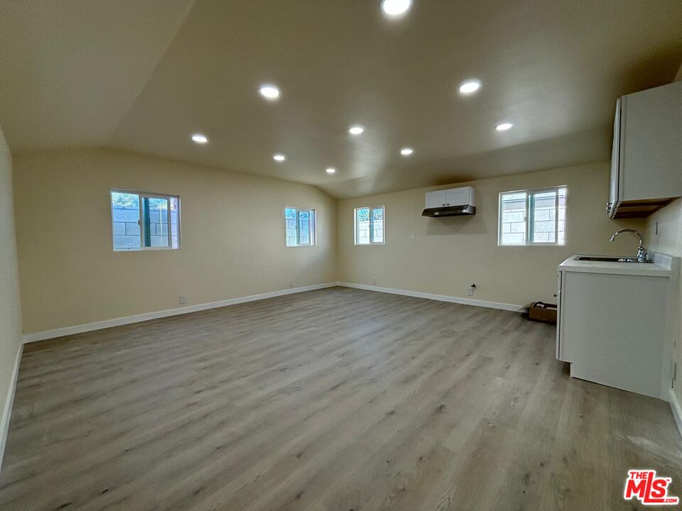 a view of a kitchen sink and a microwave in it