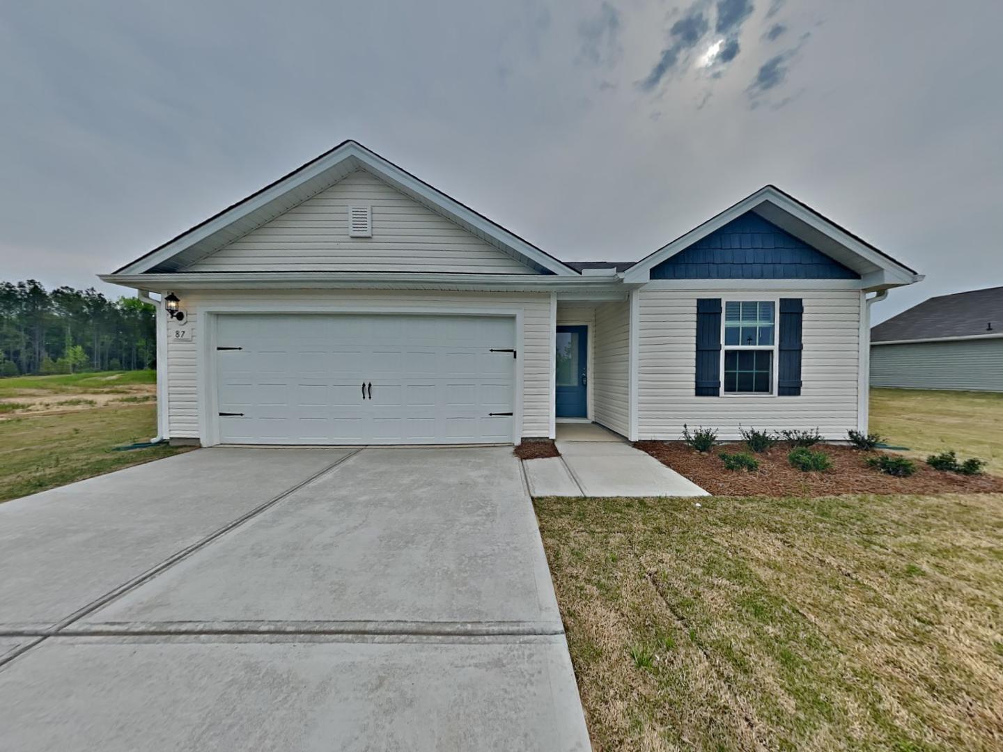 a front view of house with garage