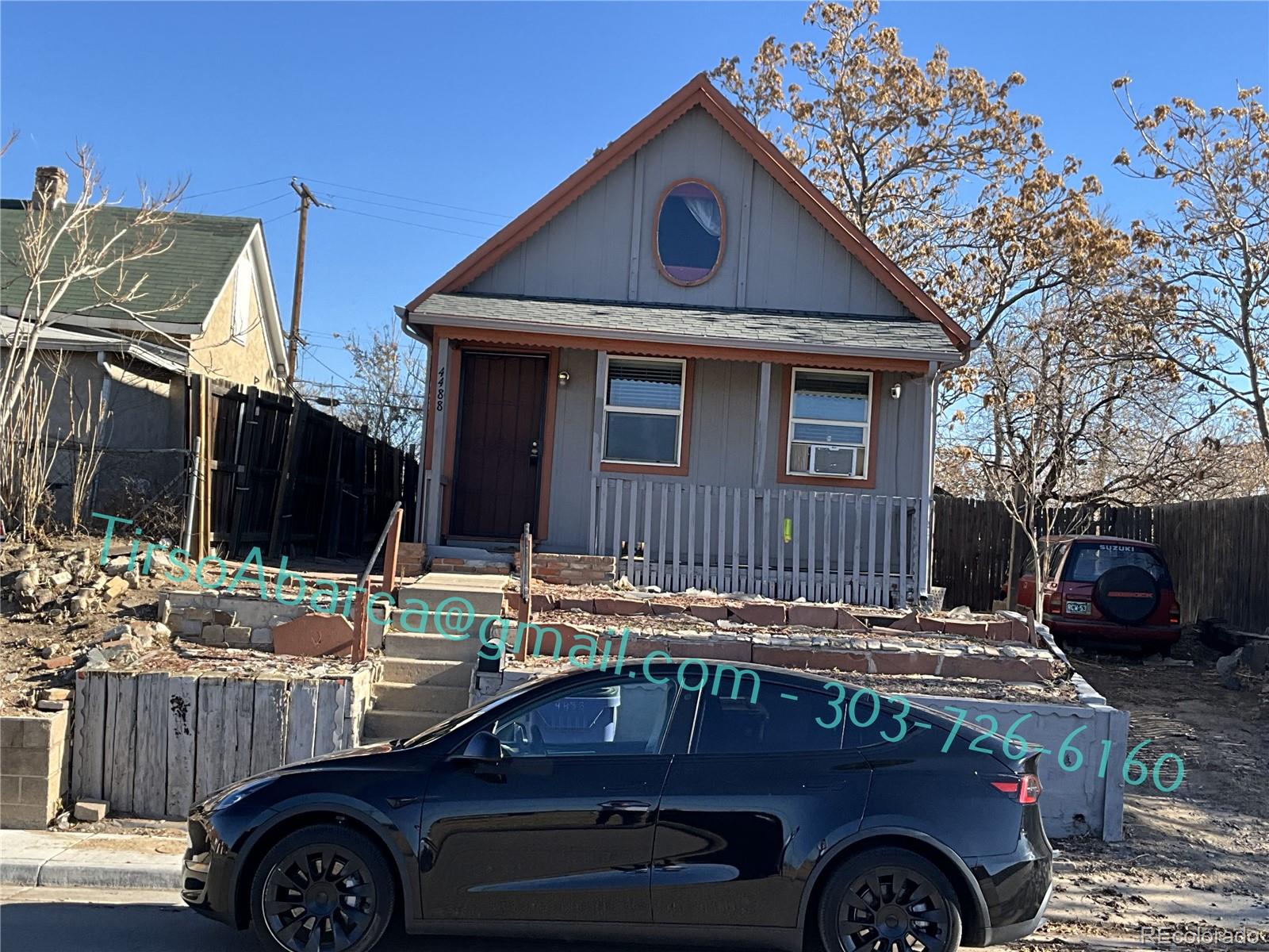 a front view of a house with parking space