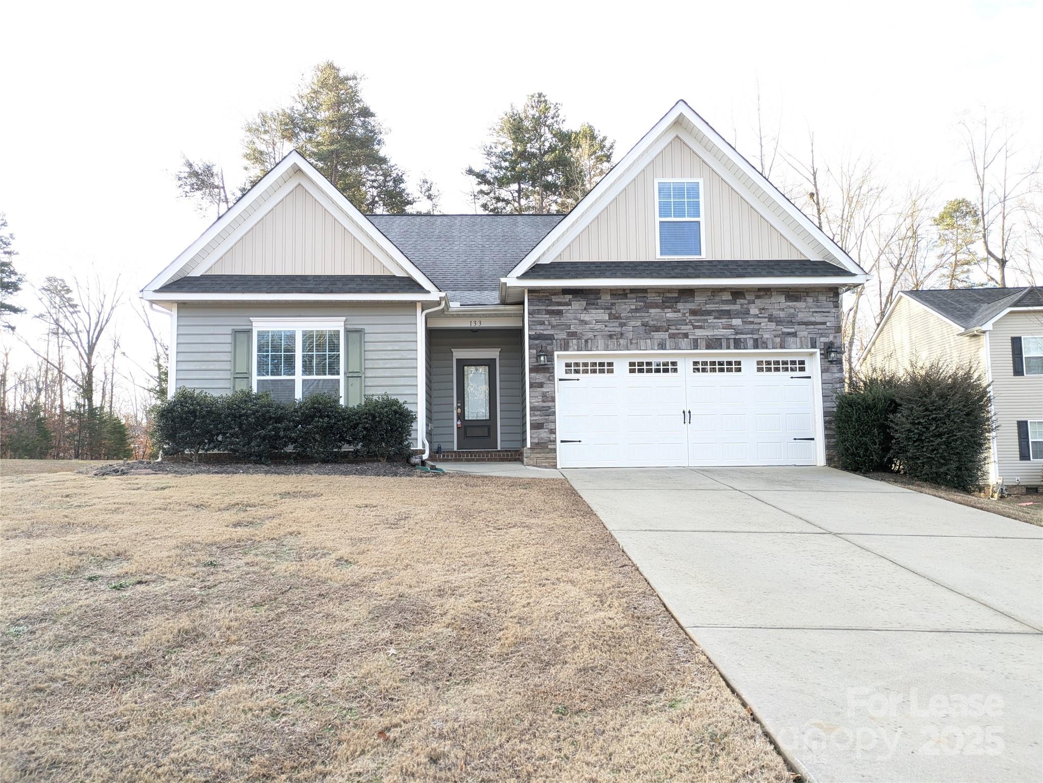 front view of a house with a yard