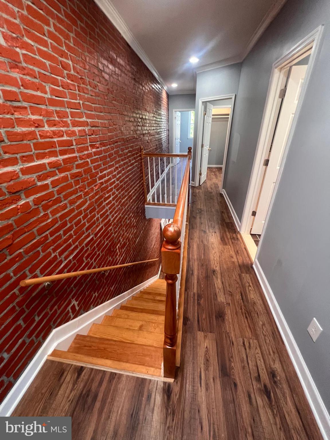 a view of entryway with wooden floor