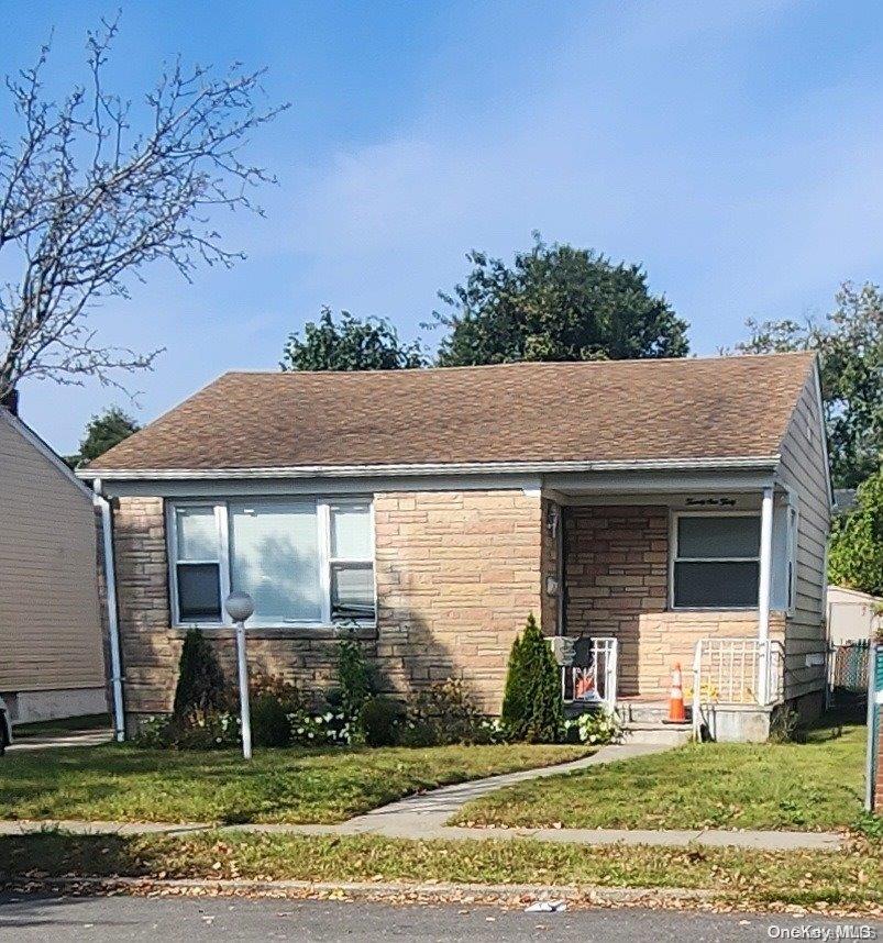 a house that has a tree in front of it