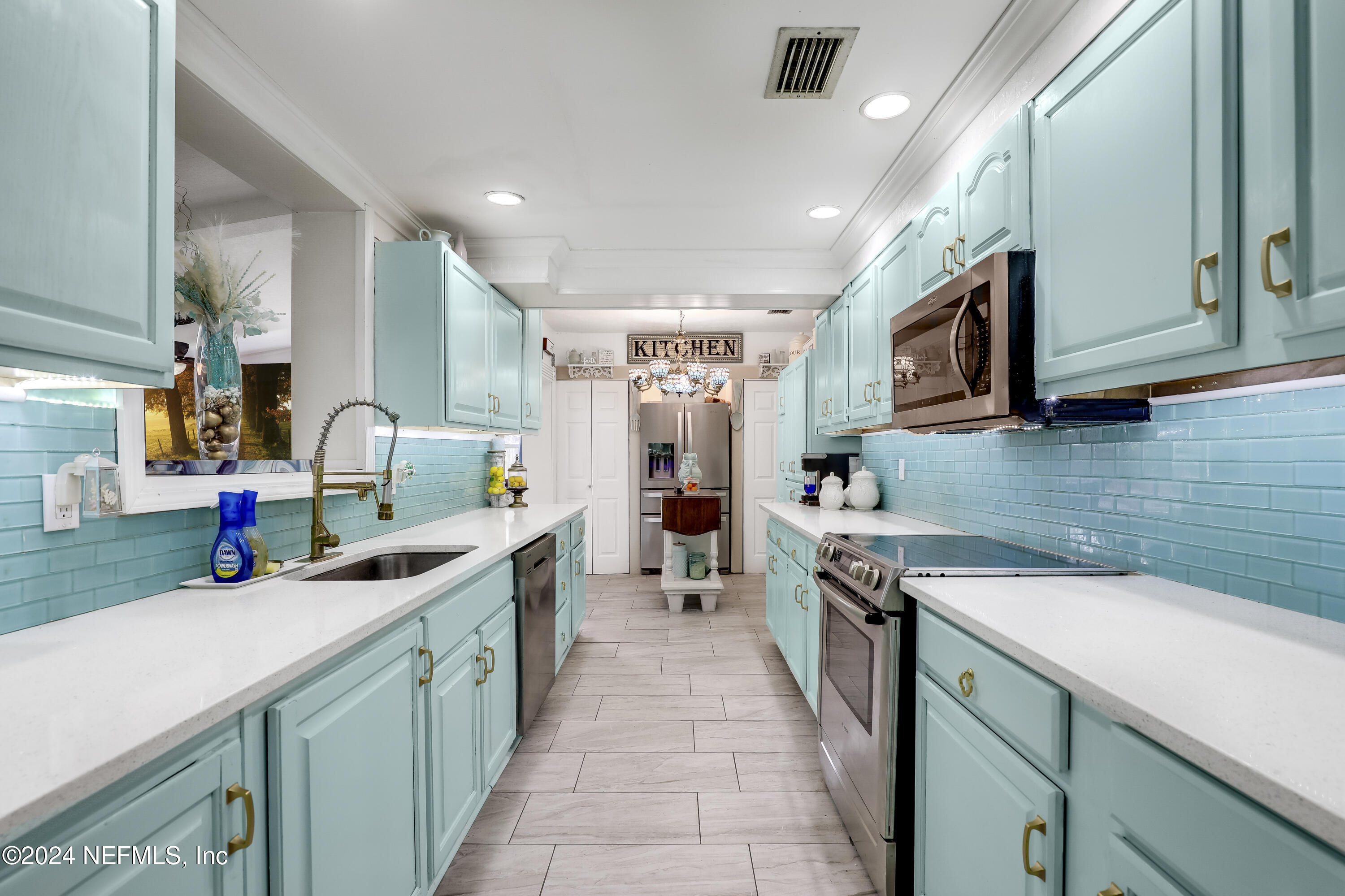 a kitchen with a sink and cabinets