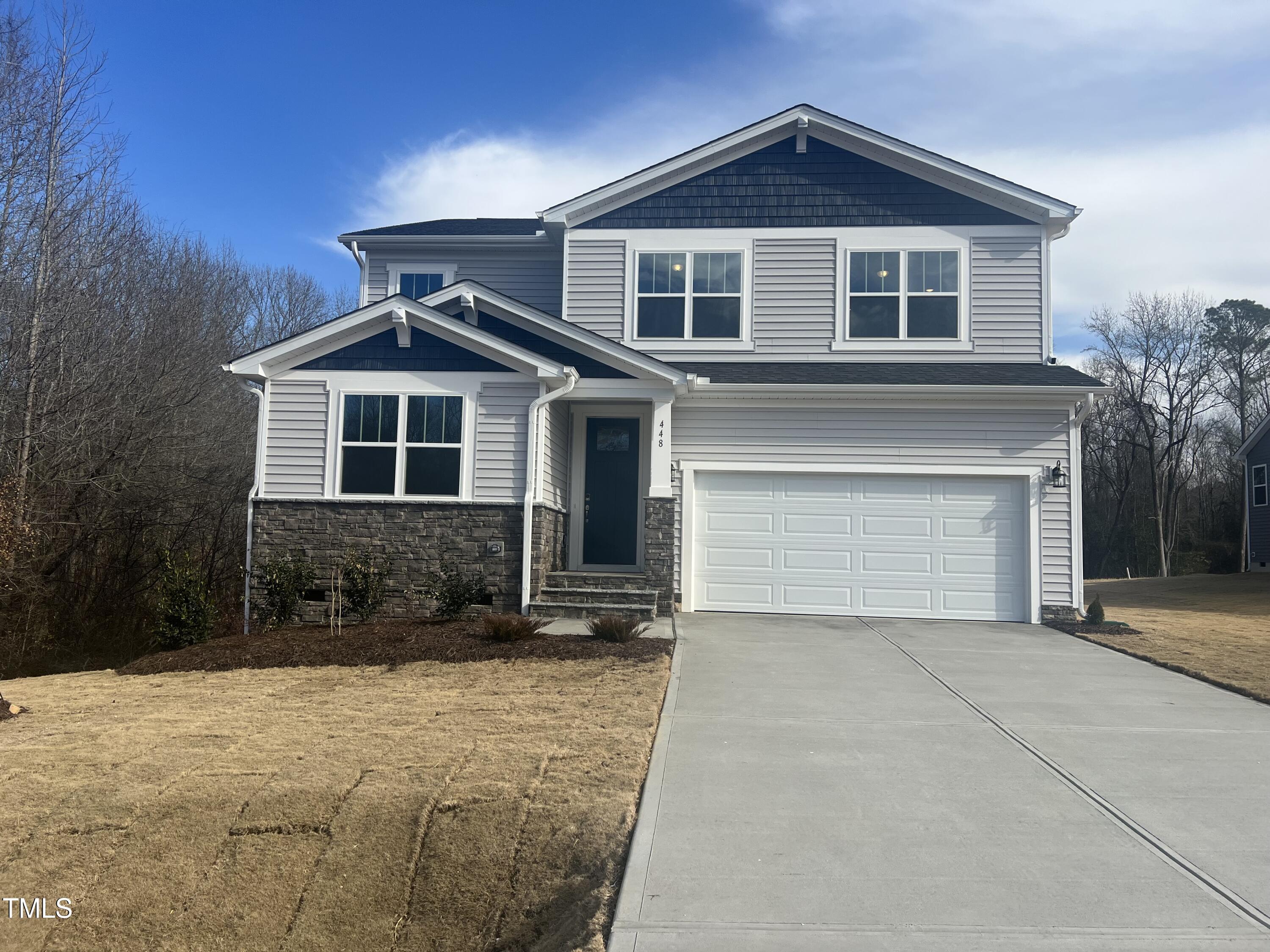 a front view of a house with yard