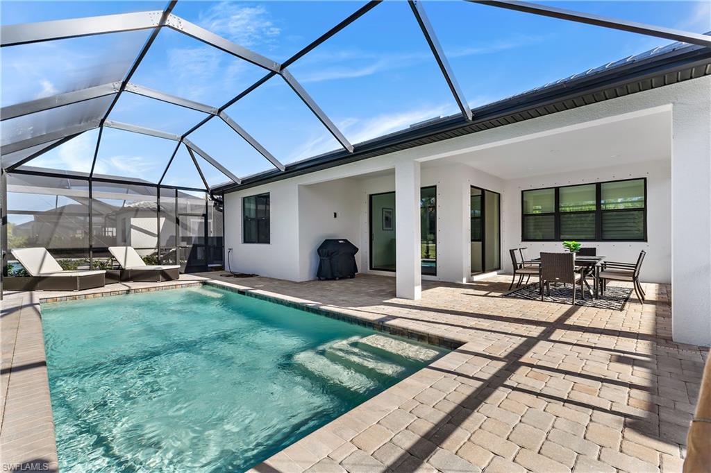 a view of a backyard with sitting area