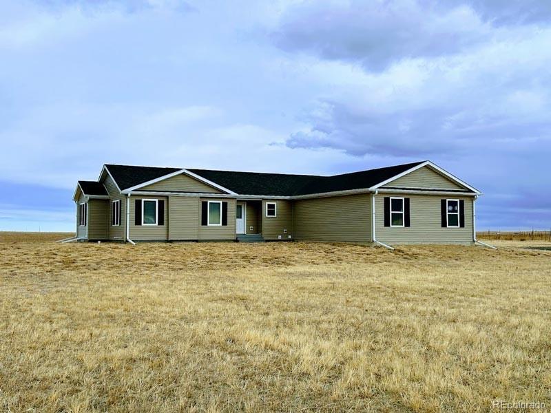 a front view of a house with yard