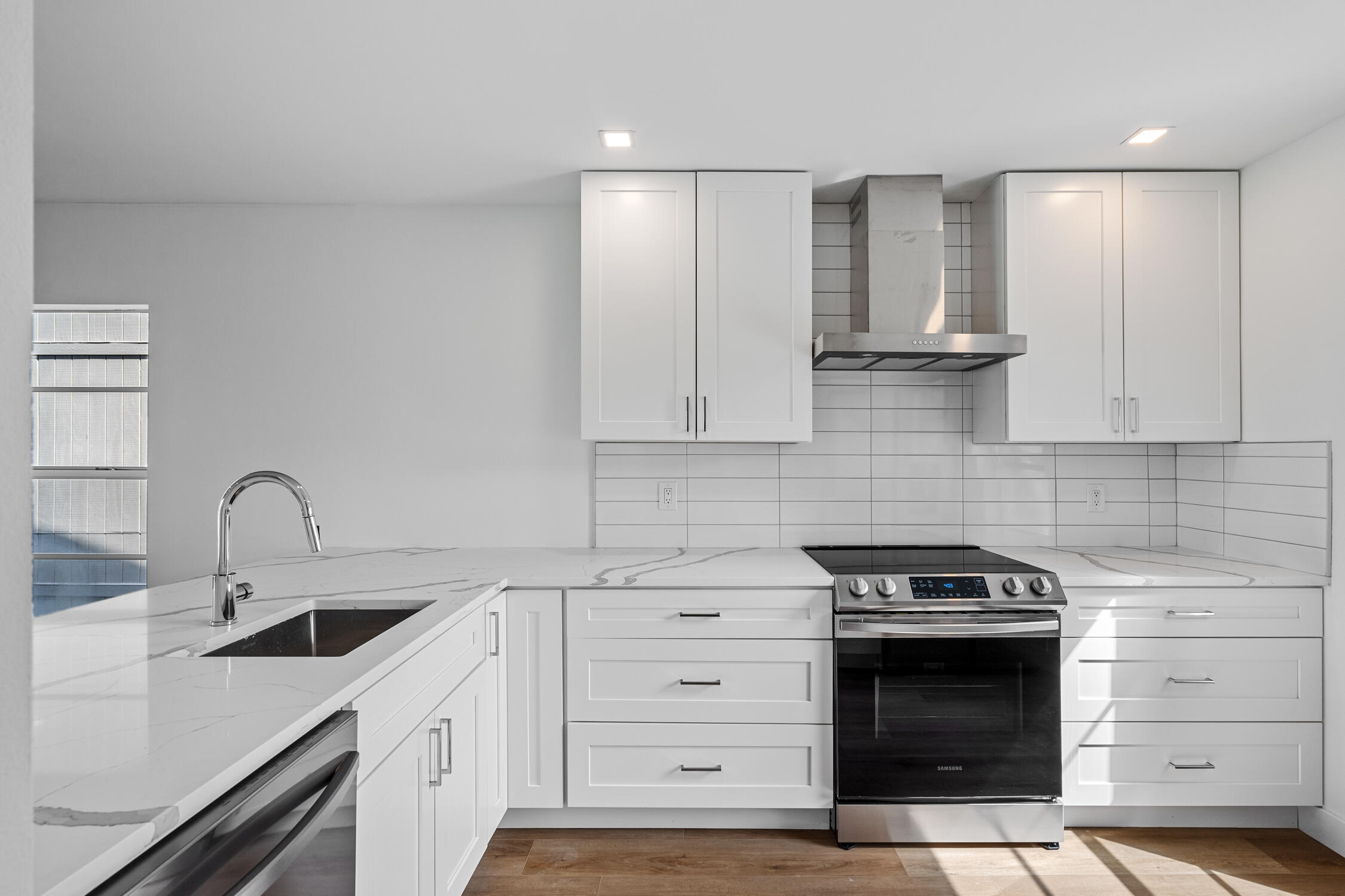 a kitchen with a stove and a sink