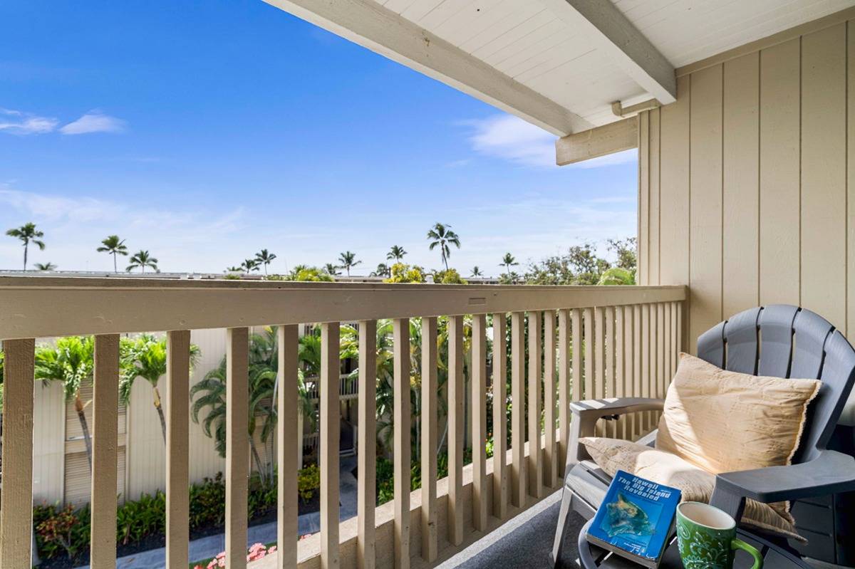 a view of balcony with wooden floor