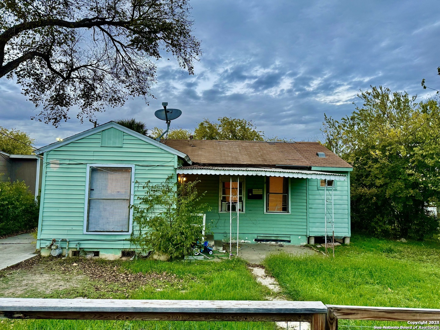 front view of a house with a yard