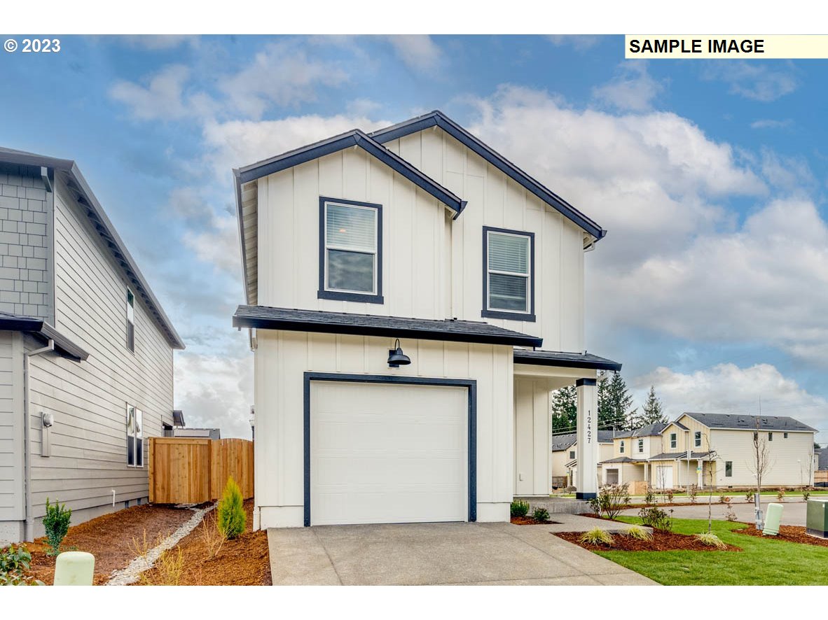 a front view of a house with a garage