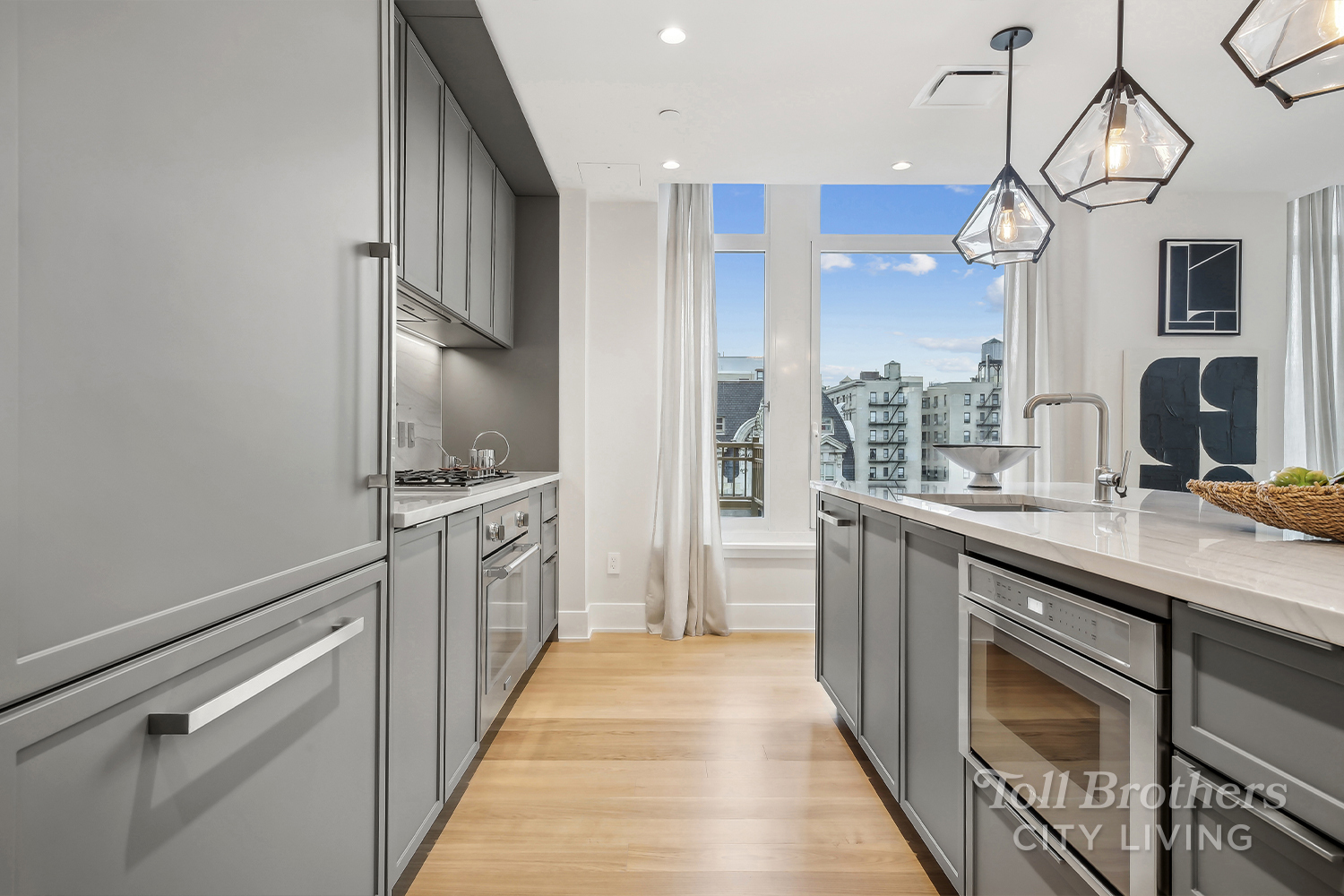 a kitchen with stainless steel appliances a sink and cabinets