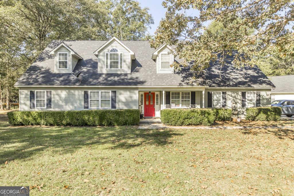 a front view of a house with a yard