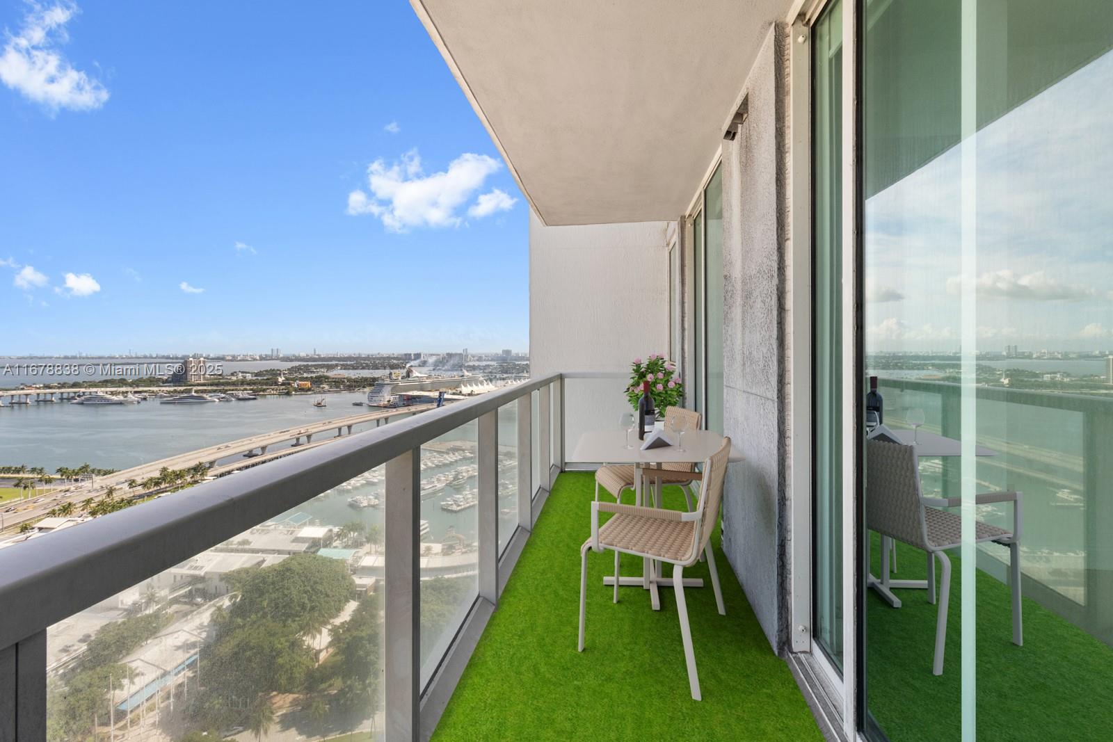 a balcony with table and chairs