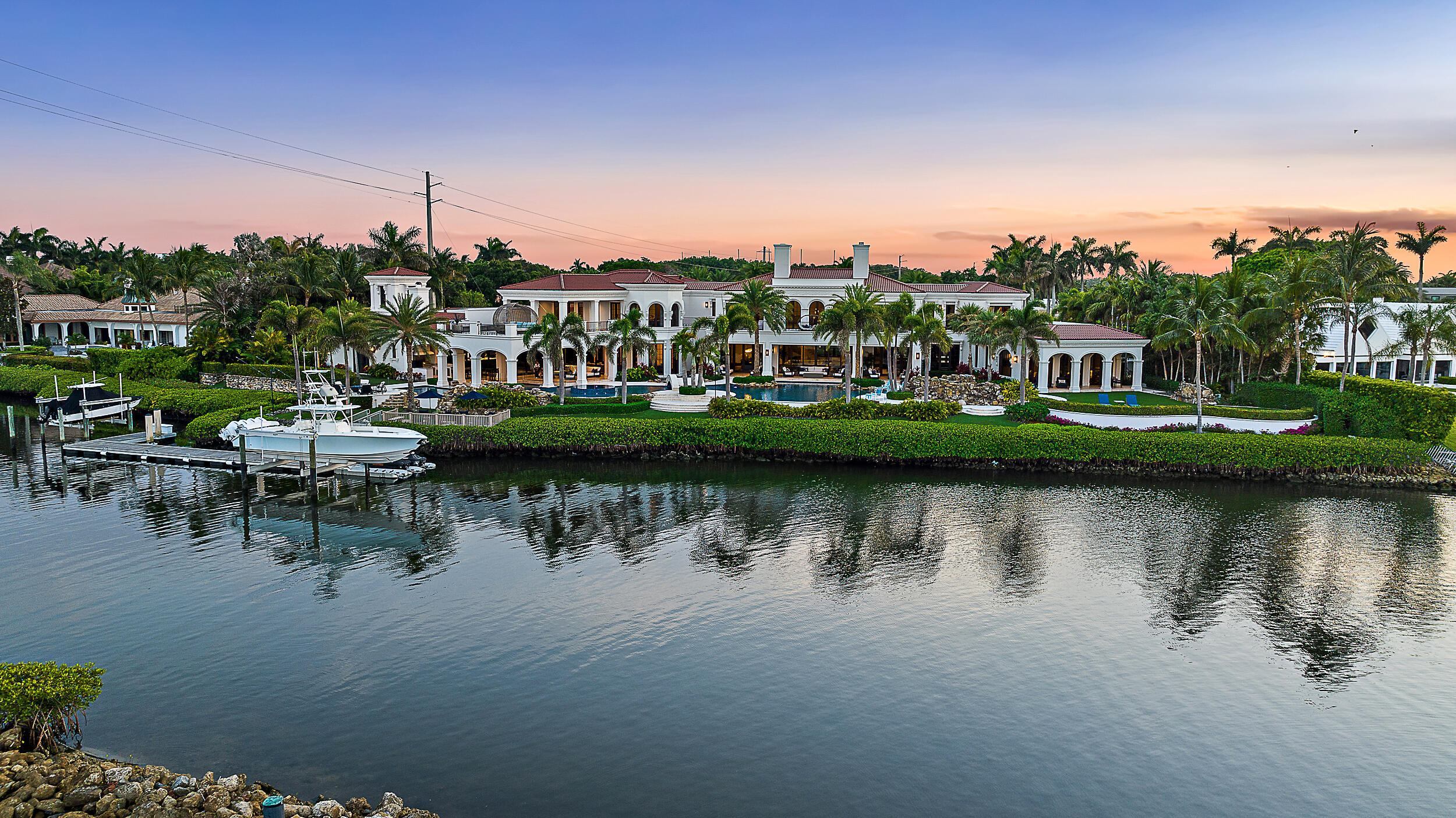 a view of a lake with a house in the background