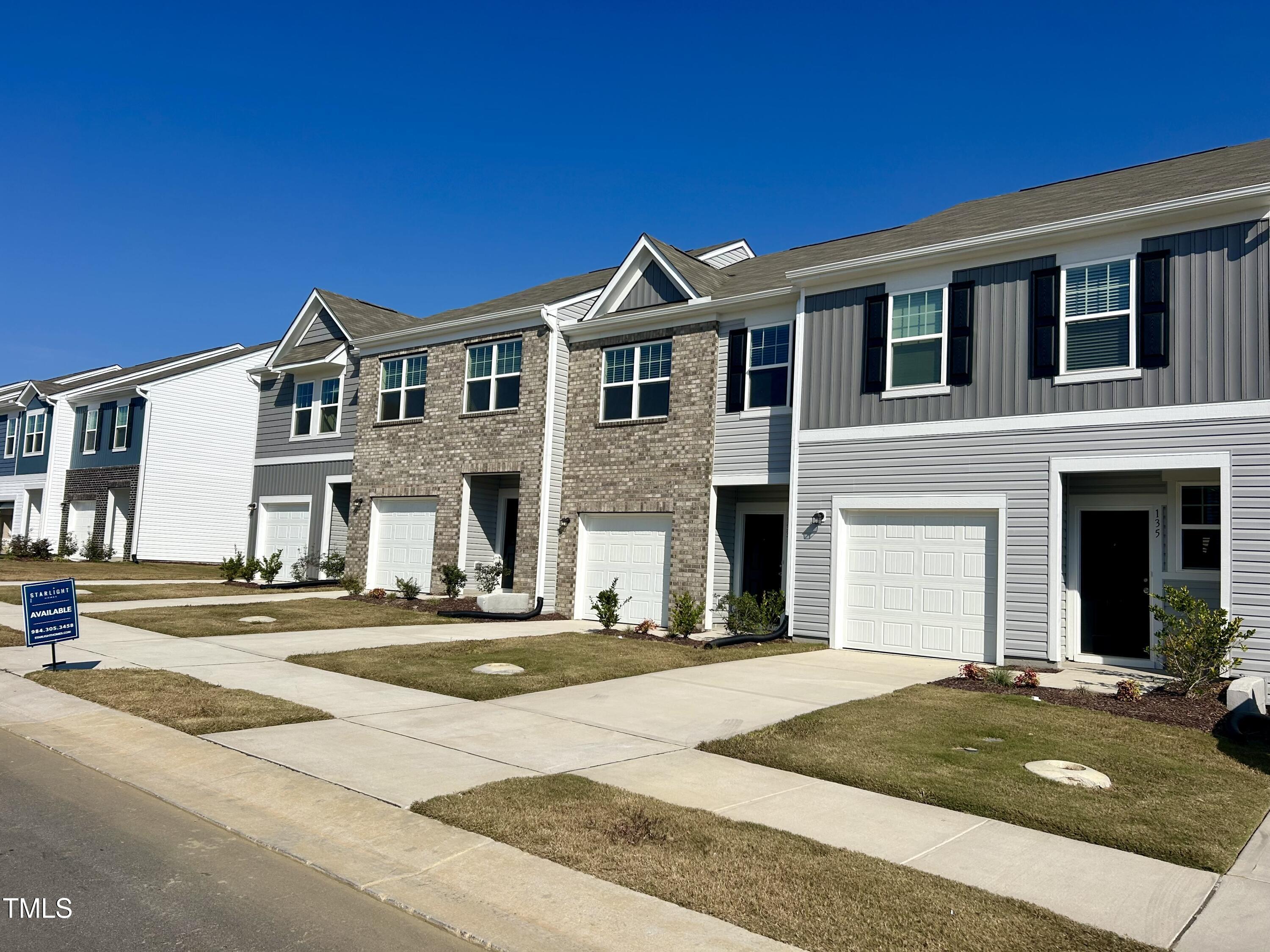 a front view of a house with yard