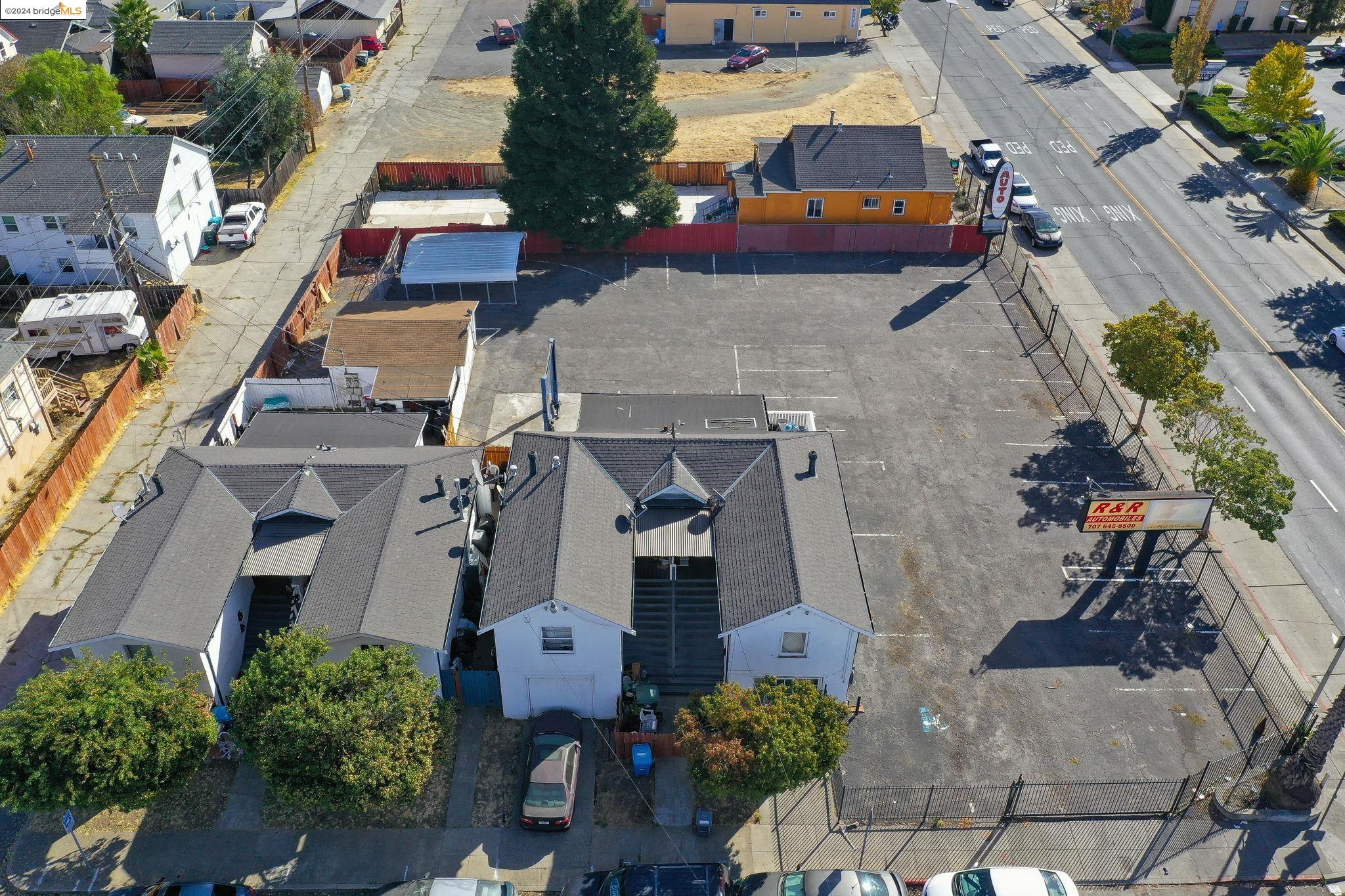 an aerial view of residential houses with outdoor space