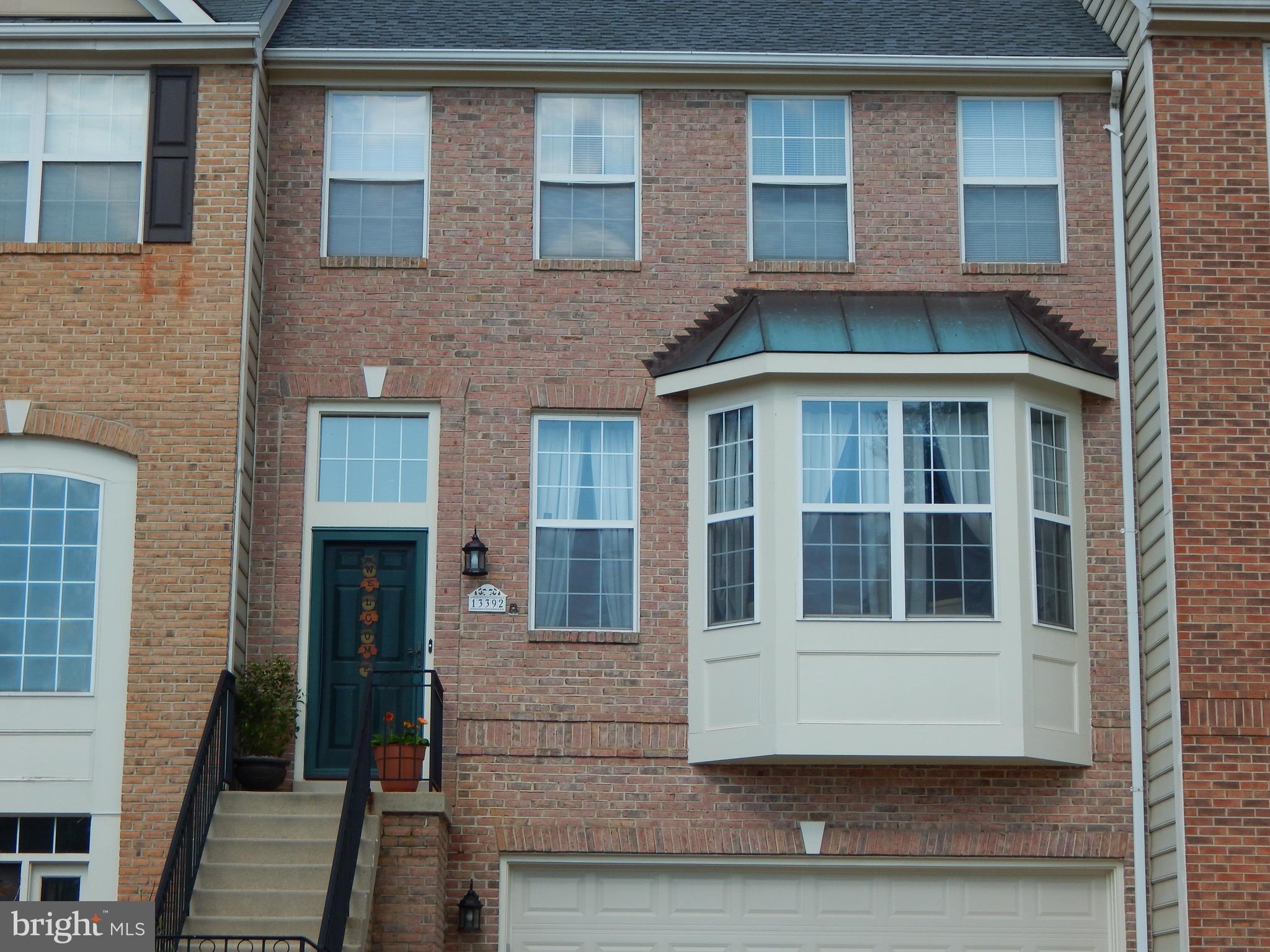 a front view of a house with a glass door