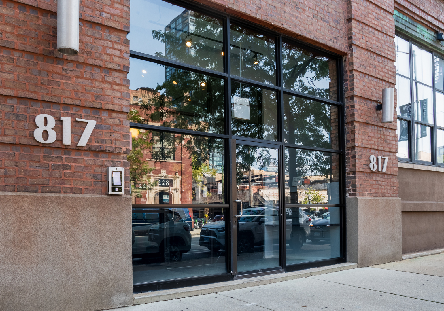 a view of a building with a glass door