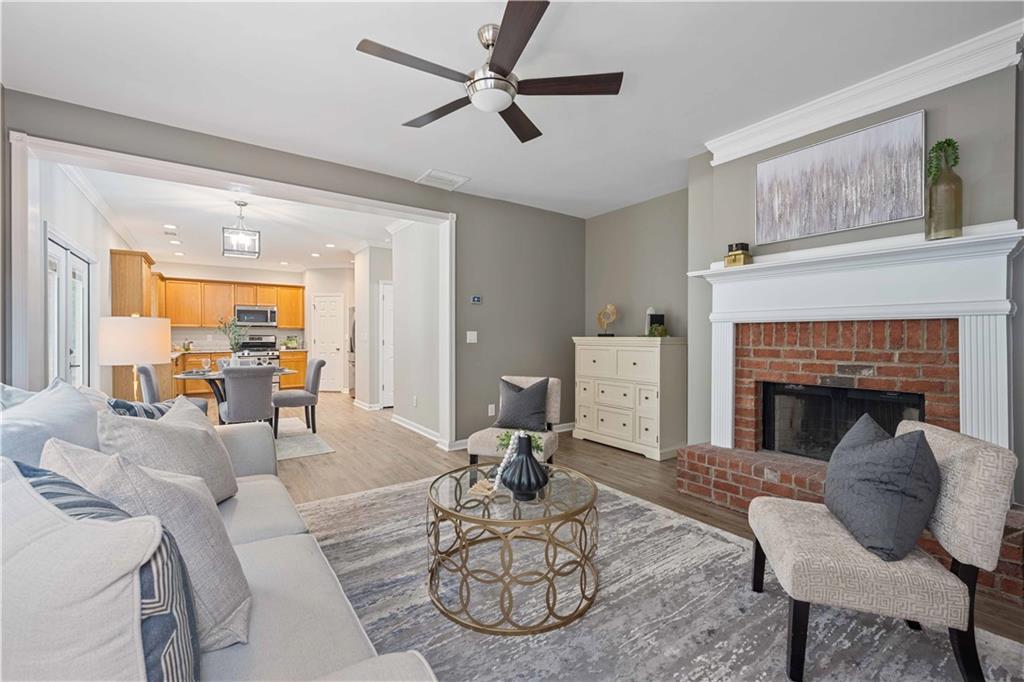 a living room with furniture and a fireplace